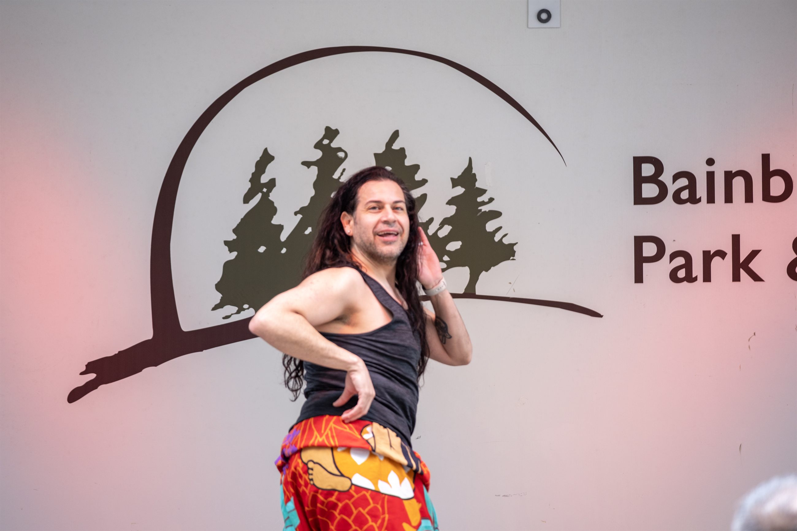 Festival crowd moving through food and activity areas.