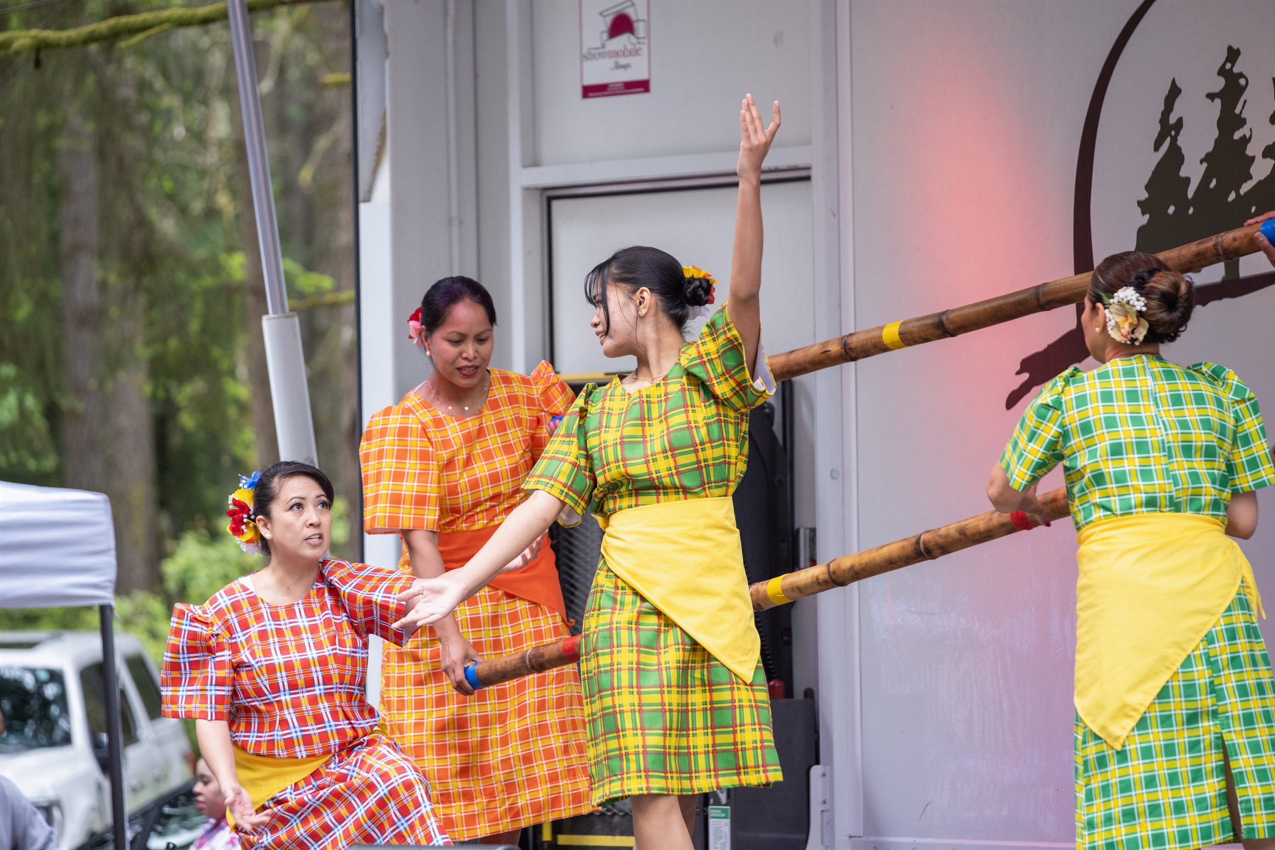Community cultural engagement at a festival booth.